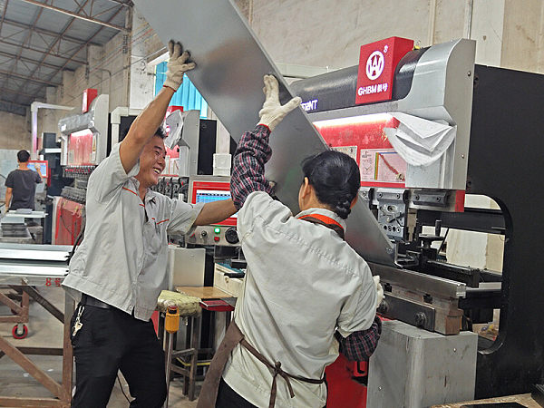 CNC bending machine in sheet metal processing workshop