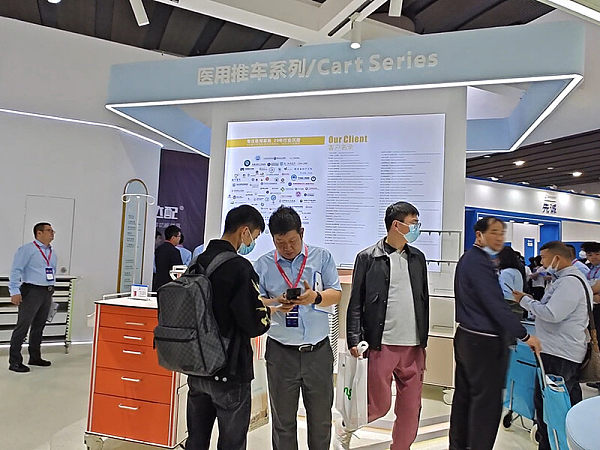 At the International Furniture Fair, the Sales Director analyzes trends in hospital furniture projects