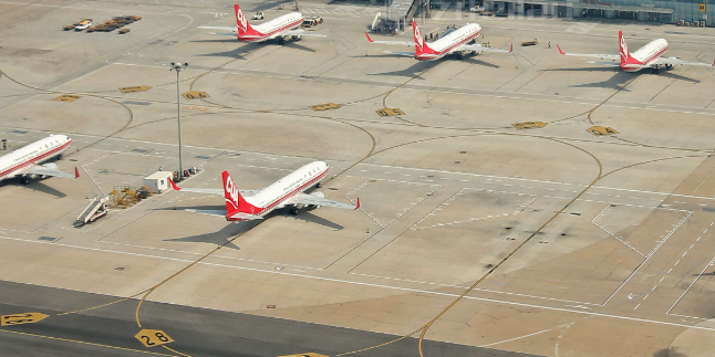 南苑机场停机坪水泥起沙处理治理项目