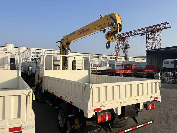 Light-duty truck with on-board crane